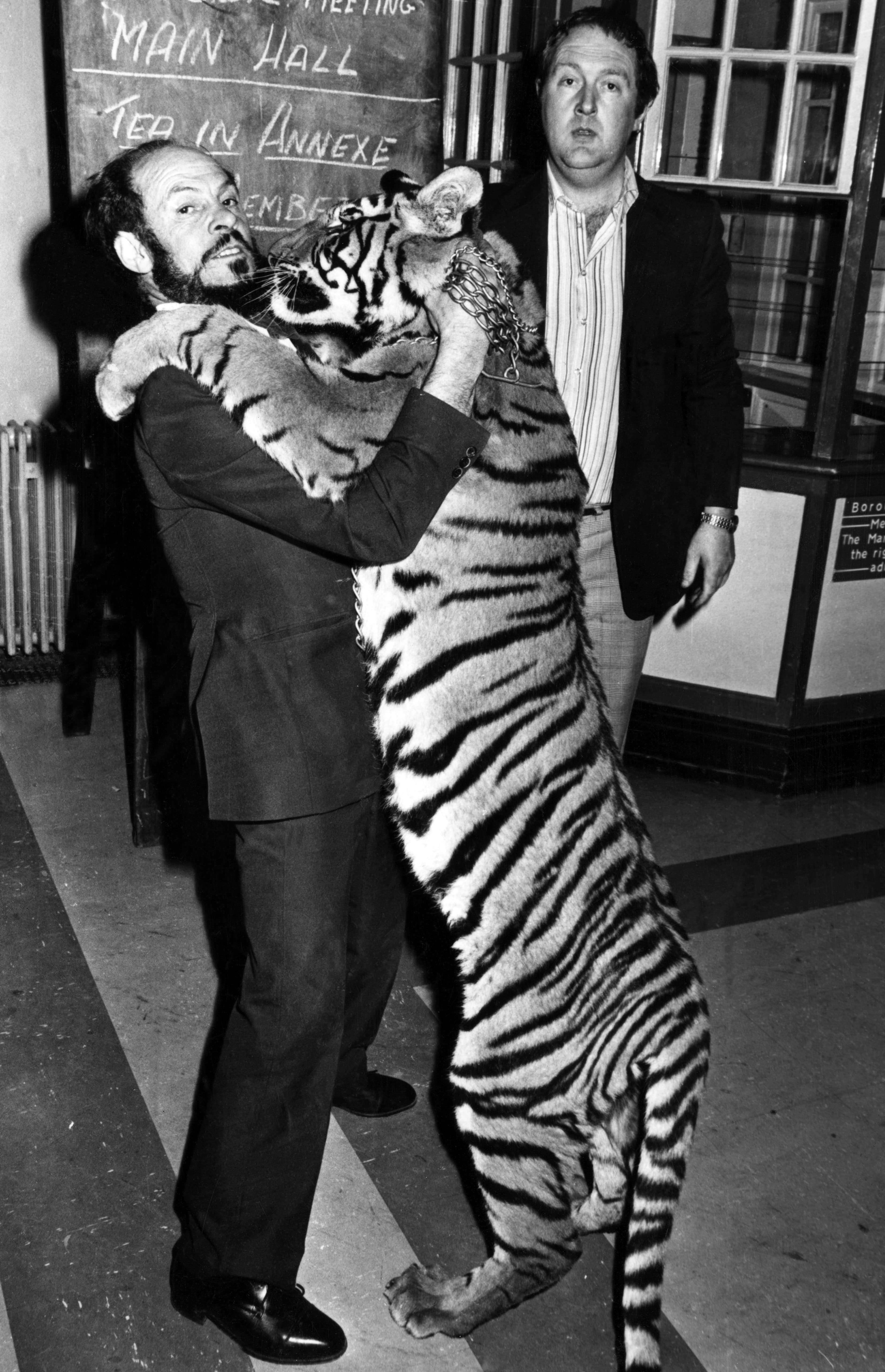 Cardiff Zoo owner Mr George Palmer, took his Bengal tigress Kali to the annual meeting of Vale of Glamorgan Borough Council to publicise a request for financial backing. He was later fined ¿20 by the town's magistrates and bound over in the sum of ¿50 to keep the peace for a year. Identical twin brothers George and Hugh Palmer ran Barry Zoo, officially called Cardiff Zoo (Barry), but known locally as Barry Zoo. May 1977.
